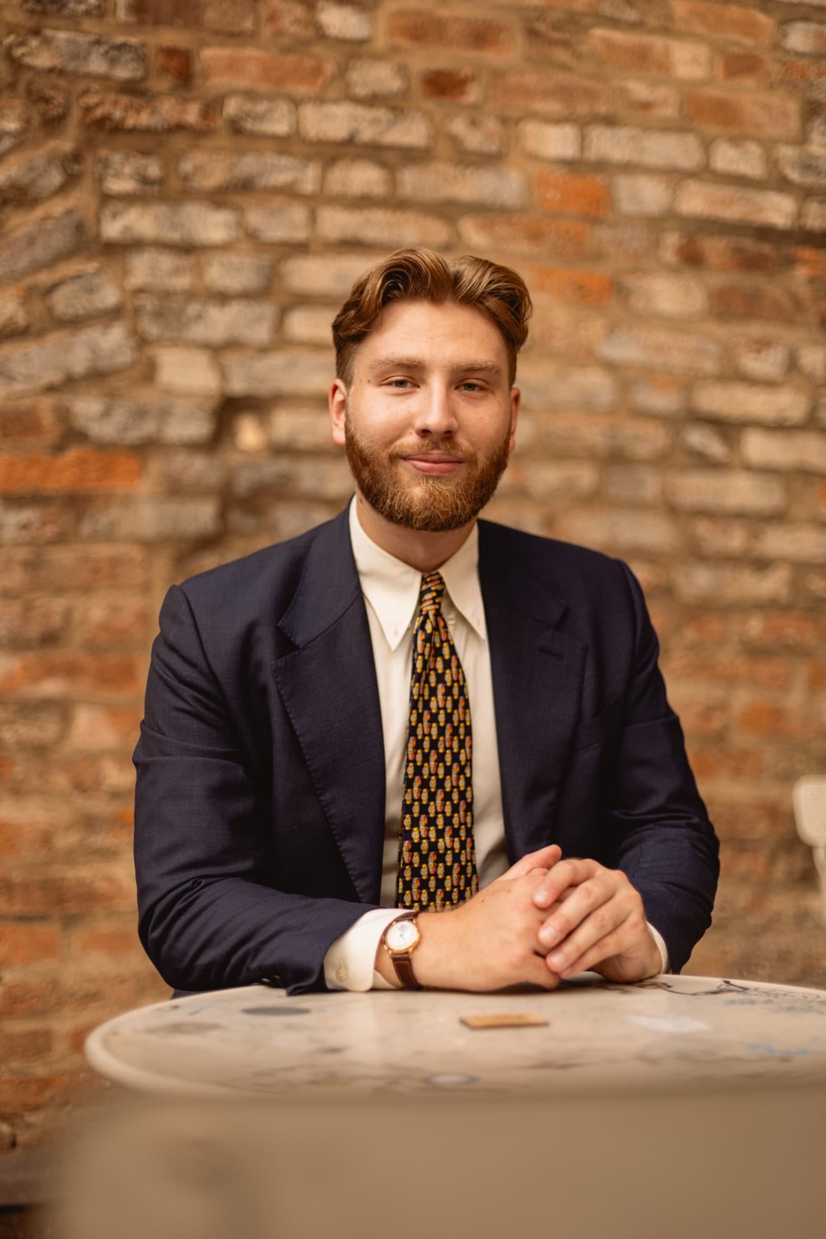 Michal Sopoliga, vintage watch dealer, wearing a vintage watch in Prague