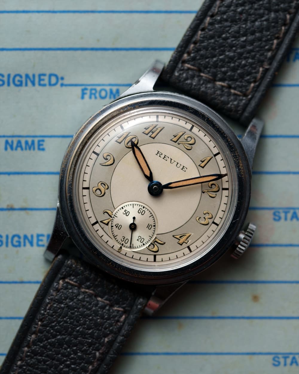 Vintage Revue with silver dial and small seconds on a grey strap